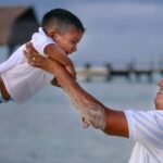 Father and Son playing on beach