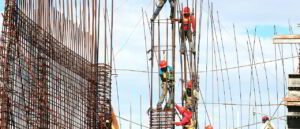 Picture of construction workmen in precarious position