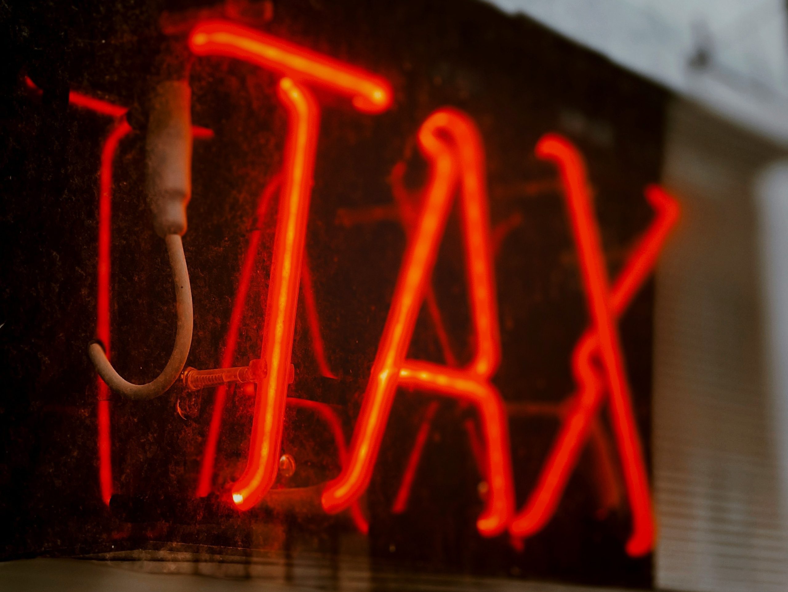 Neon sign saying Tax representing directors liabilities for PAYG Tax
