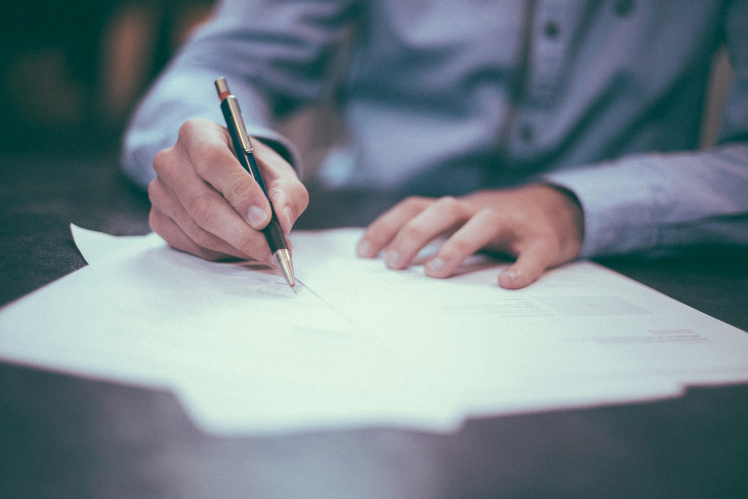 image of a lawyer's certificate being signed